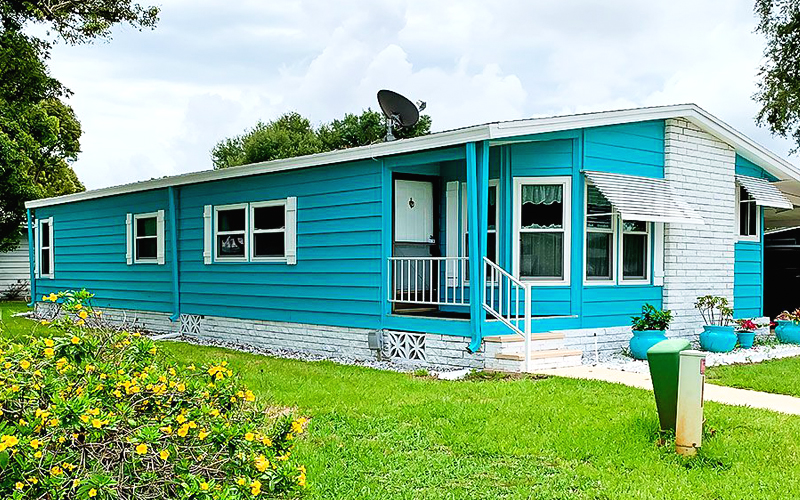a mobile home with blue light paint color