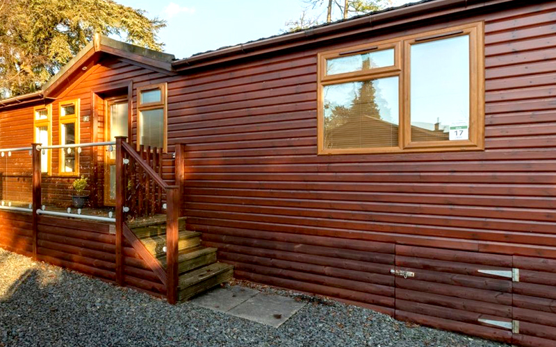 Mobile Home with Log Cabin Style Skirting
