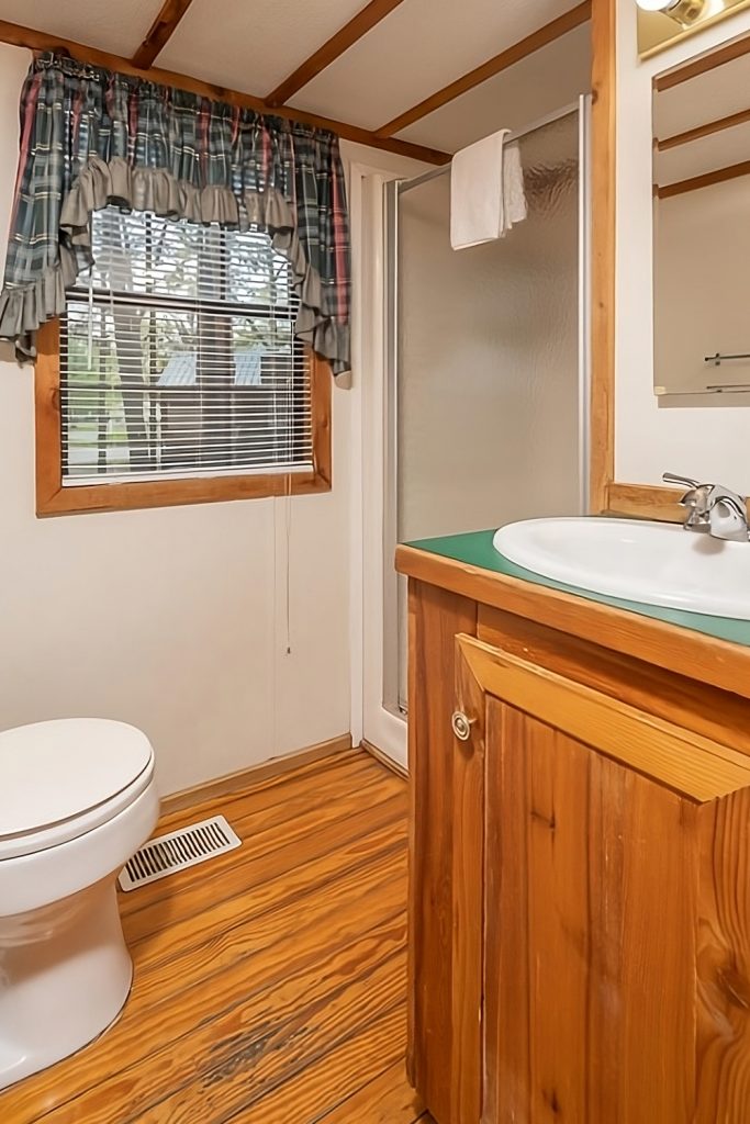 Mobile-Home-Bathroom-Window-with Patterned Curtains
