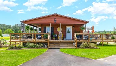 Stunning Cabin Style Mobile Home With Wrap Around Porch And Deck