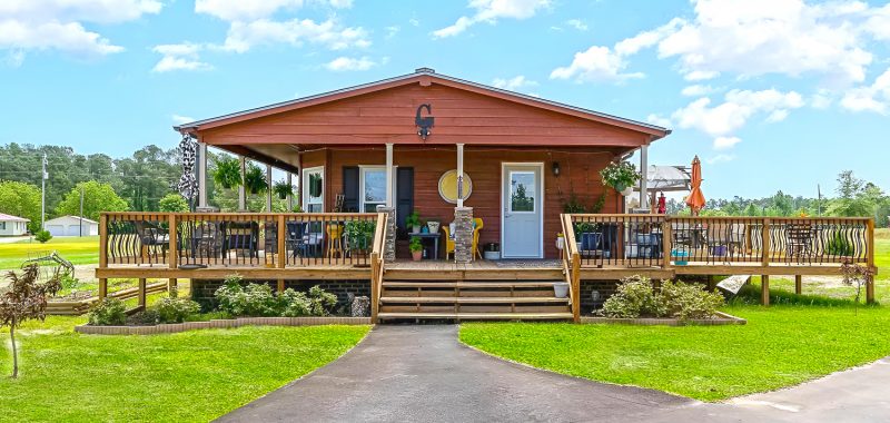Stunning Cabin Style Mobile Home With Wrap Around Porch And Deck