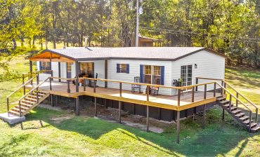 Double Wide Mobile Home with A Wrap Around Porch and Modern Interior