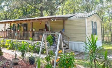 Inviting Single Wide Mobile Home with a Warm Rustic Porch