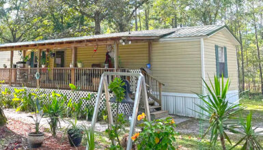 Inviting Single Wide Mobile Home with a Warm Rustic Porch