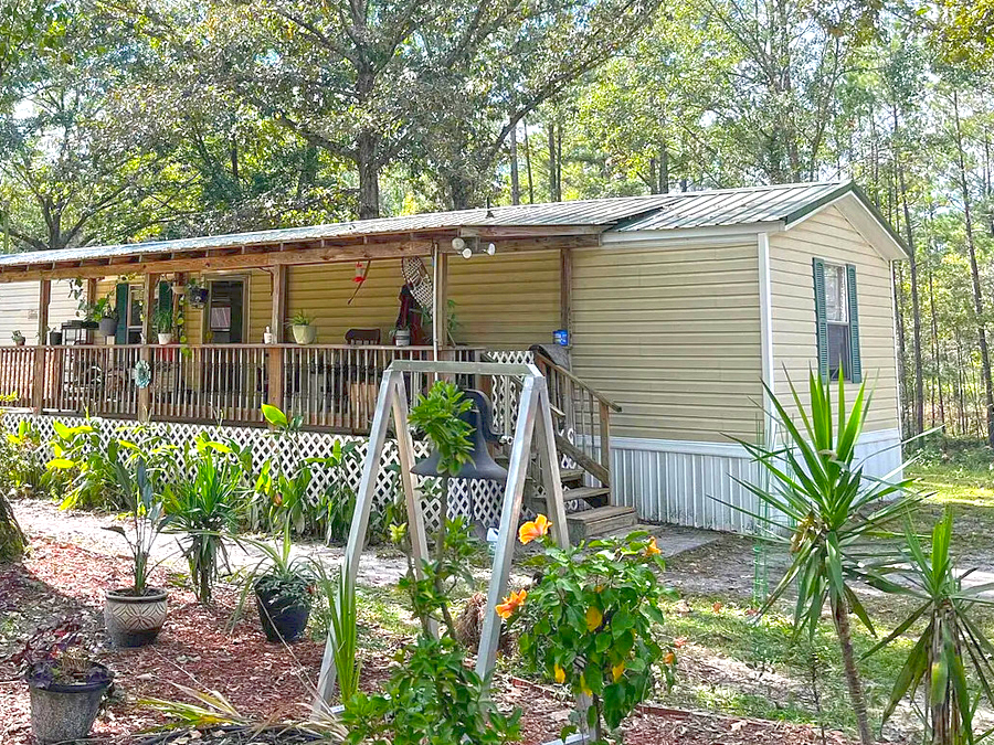 Inviting Single Wide Mobile Home with a Warm Rustic Porch