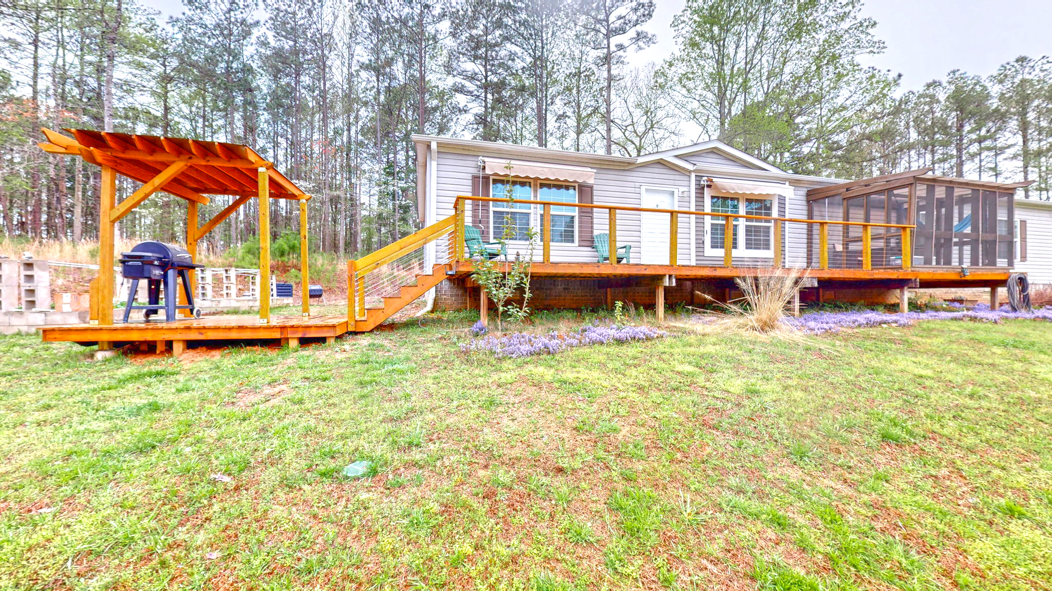 The Modern Cable-Rail Deck With a Grill Pergola and Screen Room
