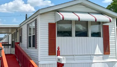 White Single Wide Mobile Home With Cozy Interior and Classic Red Curb Appeal